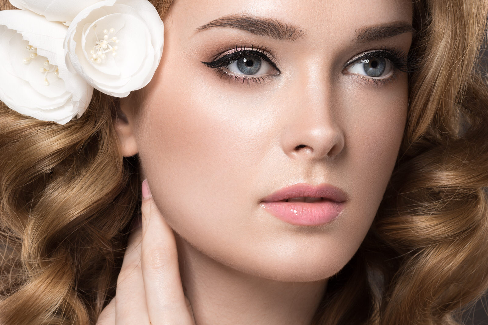 beautiful woman in the image of the bride with flowers